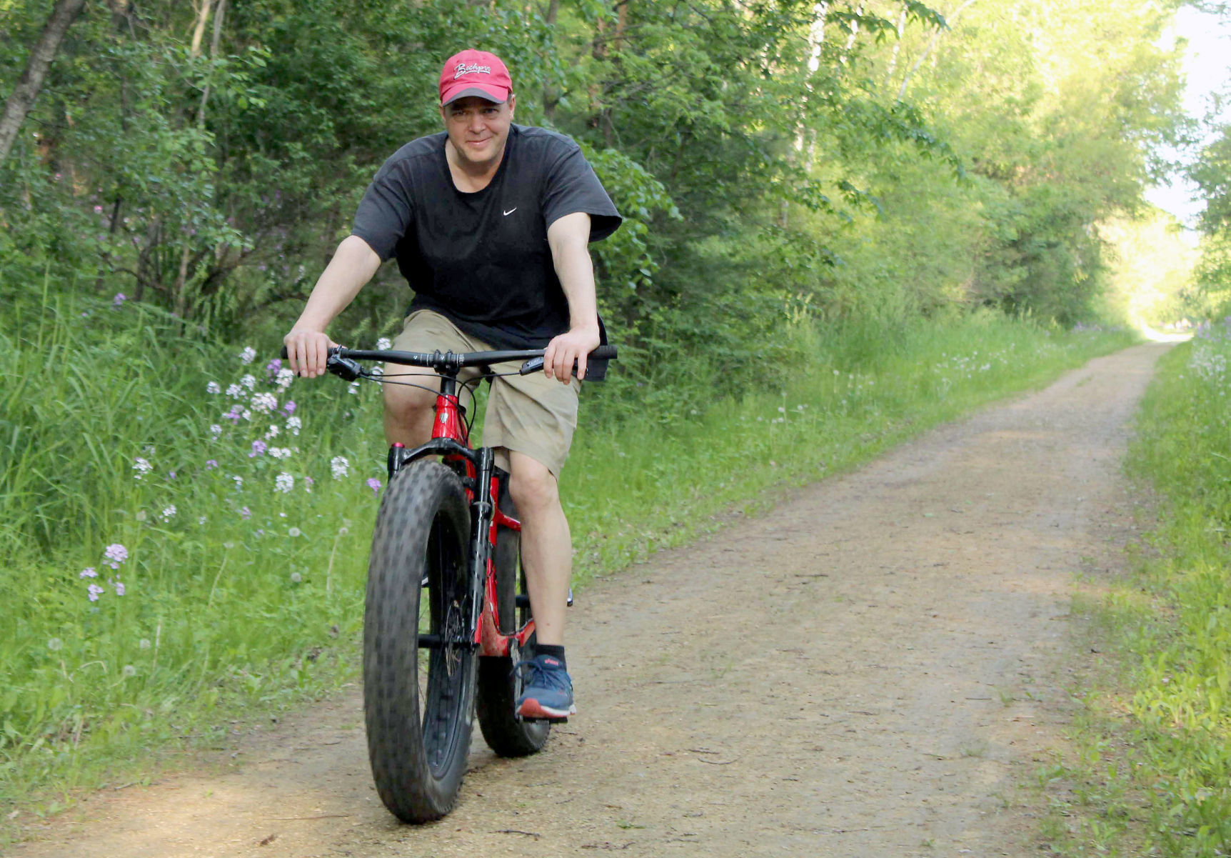 Dan rides bike on 400 State Trail